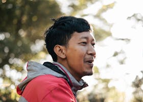 Man in Red and Gray Hoodie Jacket Smiling
